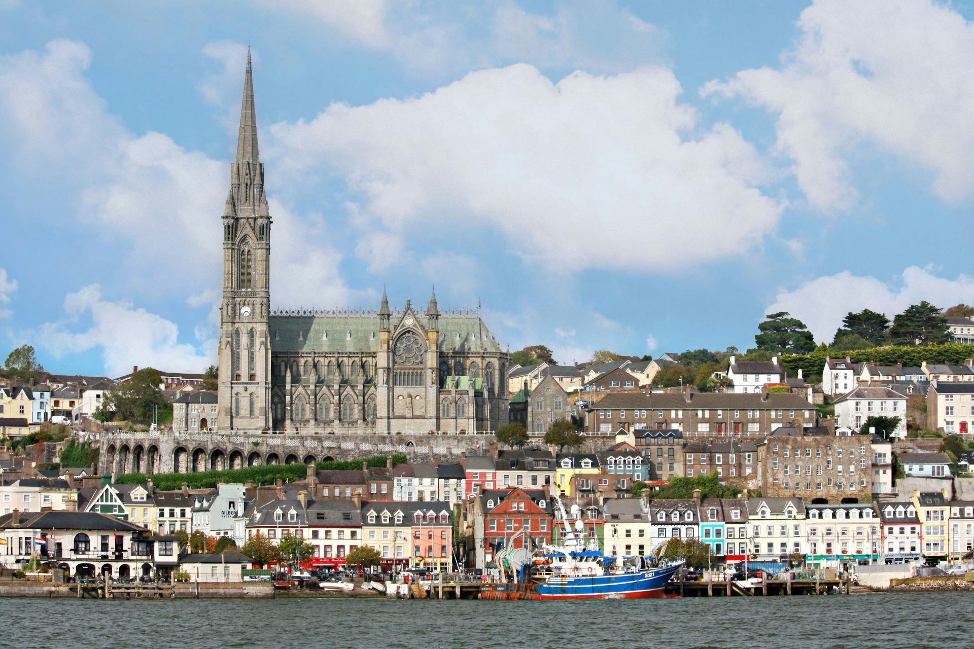 Cobh harbour in County Cork with the cathedral on the hill and colourful terraced houses
